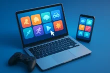 Laptop y smartphone mostrando iconos de videojuegos en pantalla sobre fondo azul